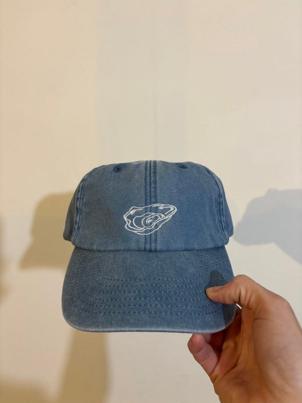 Denim pet met lijntekening van een oester