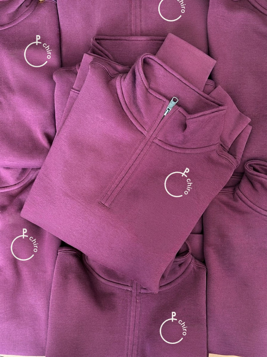 Half-zip sweaters with a small printed logo on the chest (example, edited photo)