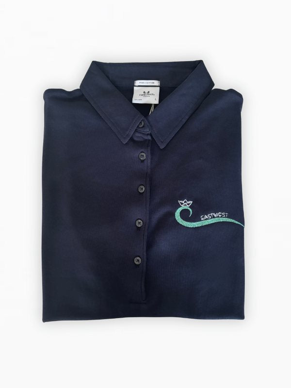 Polo shirt with an embroidered logo, worn
